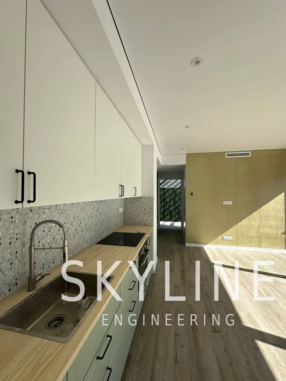 Finished kitchen with sage cabinetry and mosaic splashback in a Lanucia 6 villa, La Nucía