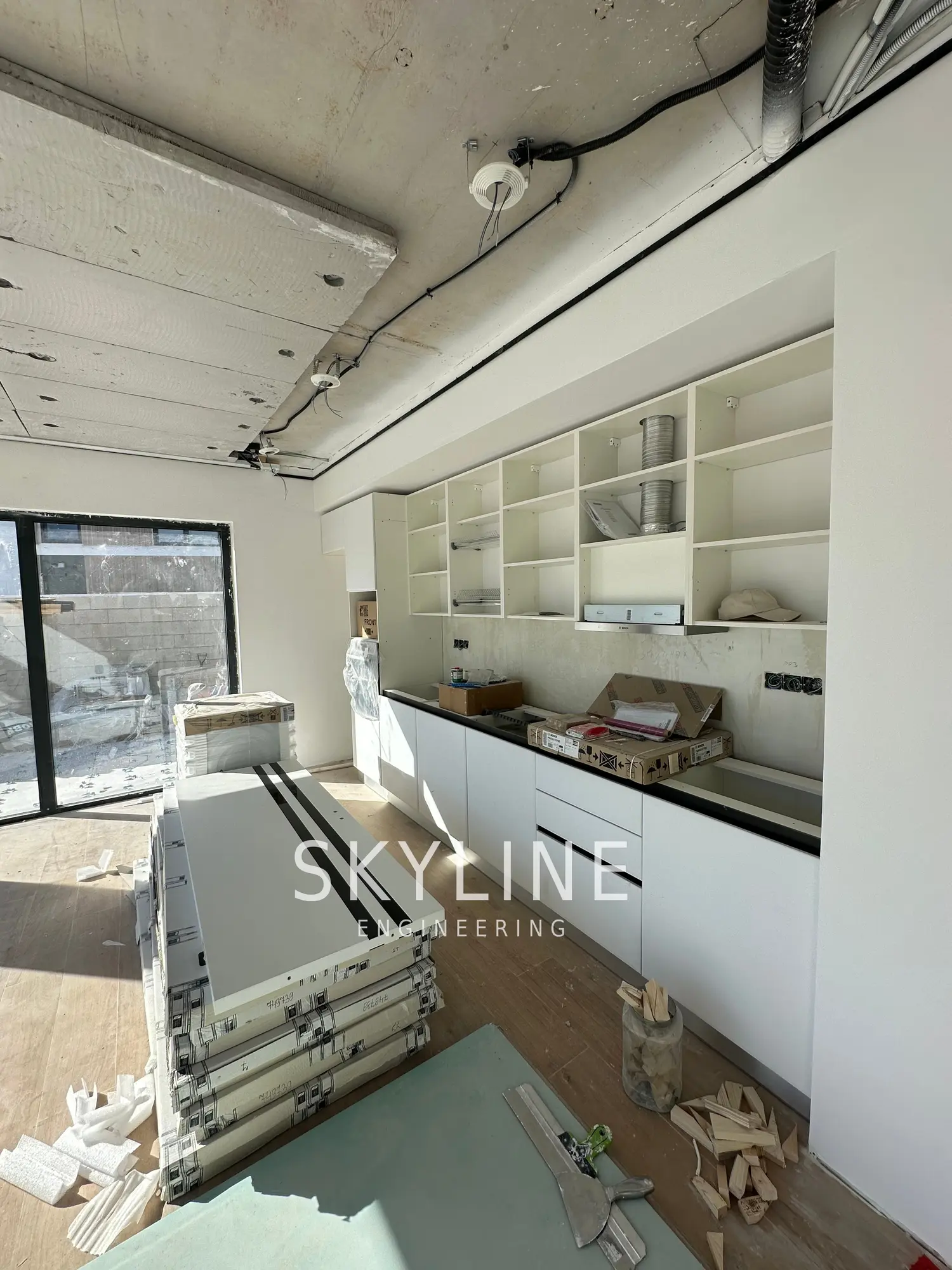 Kitchen cabinetry being installed inside one of the Lanucia 6 villas in La Nucía