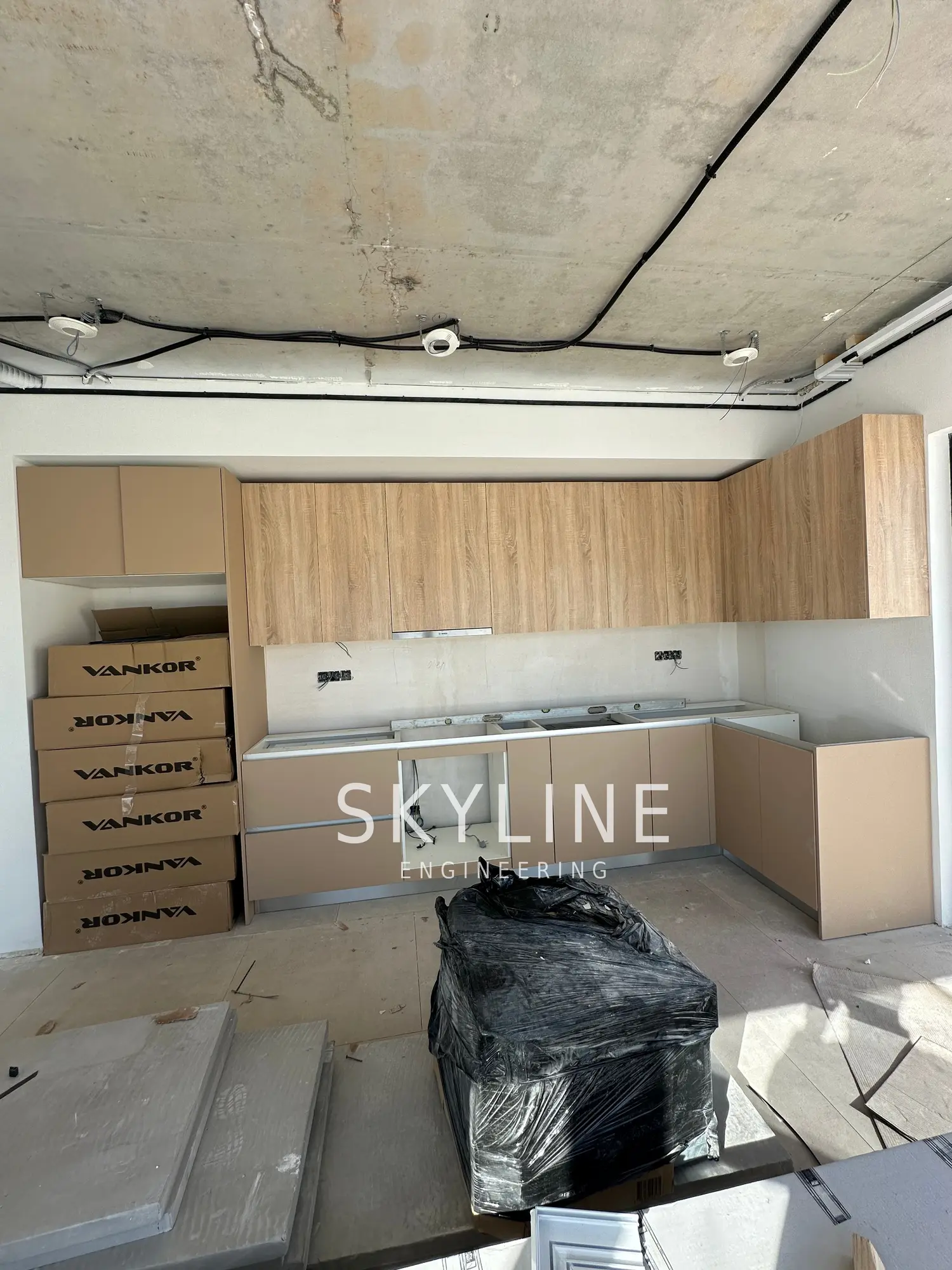 Open-plan kitchen and living area during first-fix works inside a Lanucia 6 villa, La Nucía