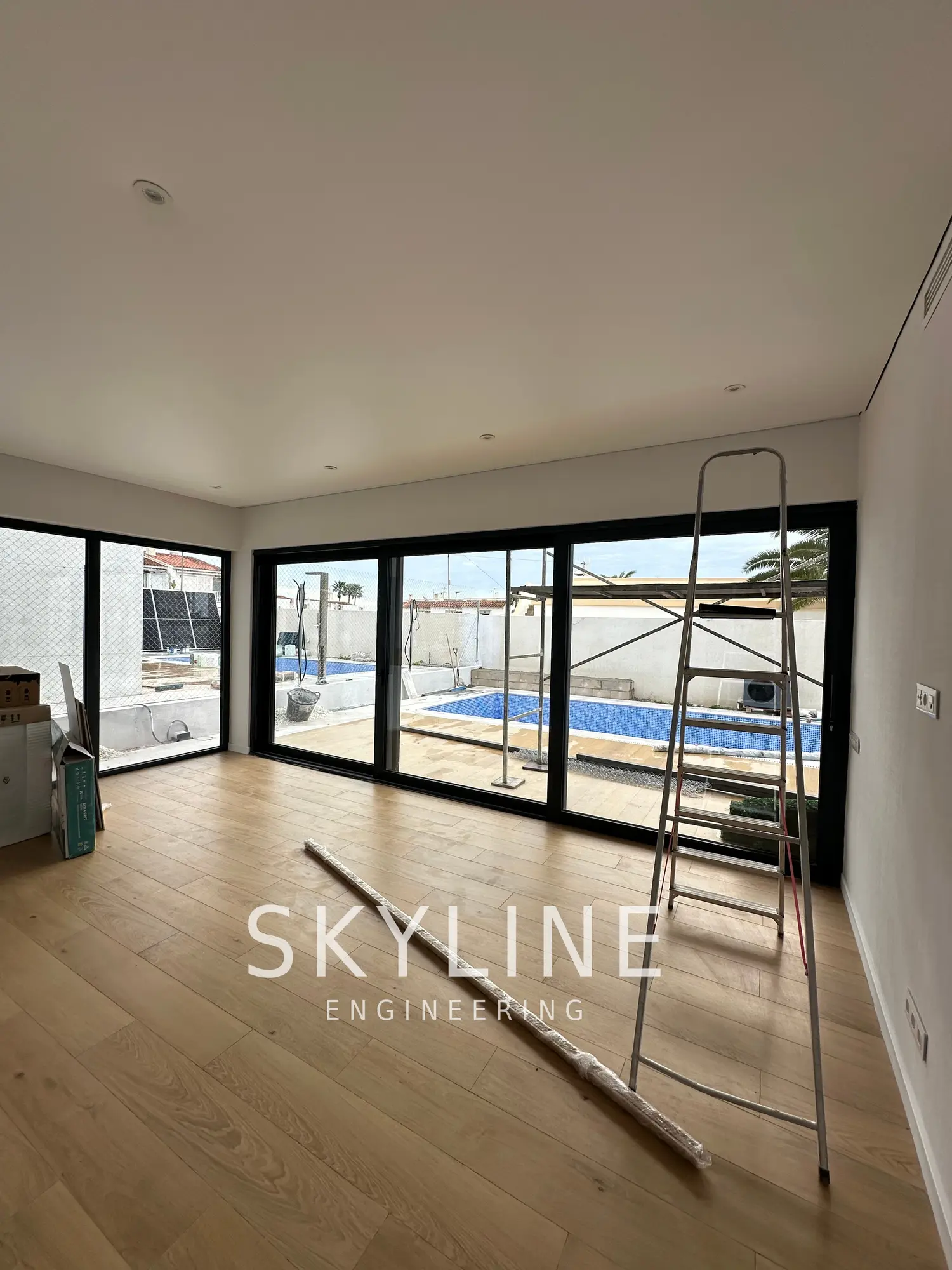 Living room of a finished Lanucia 6 villa in La Nucía looking out over the private pool