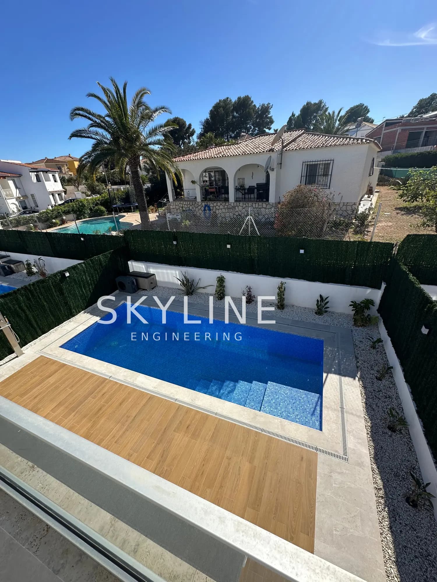 Elevated view of a finished Lanucia 6 villa pool and landscaped garden in La Nucía