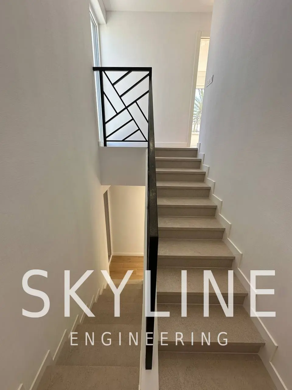 Finished interior staircase with geometric metal balustrade in a Lanucia 6 villa, La Nucía