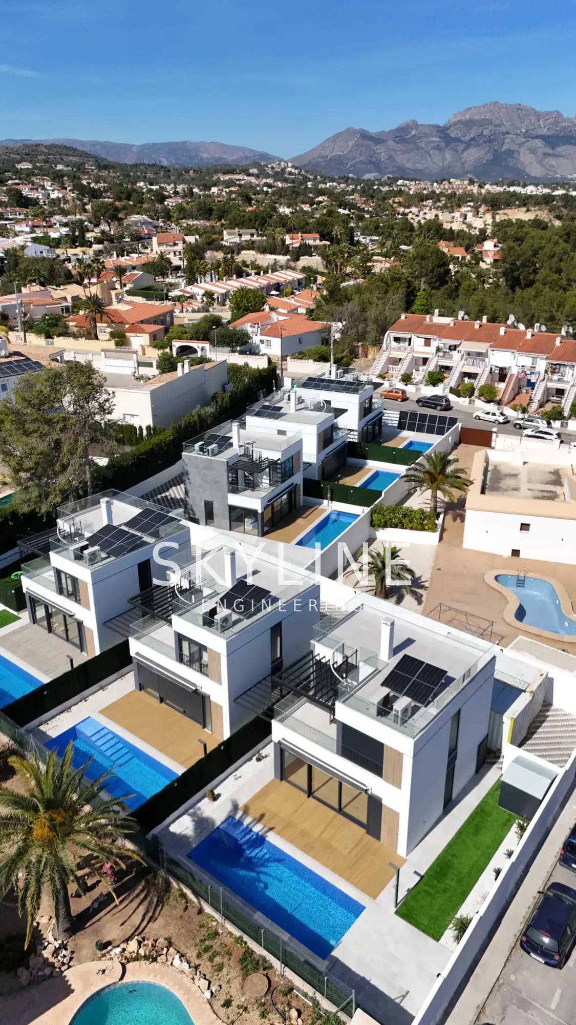 Aerial view of the gated Lanucia 6 urbanization in La Nucía showing all six villas with private pools